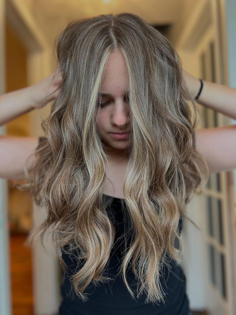 Stylist applying Bedminster balayage at a top Somerset County salon, creating on-trend hair color and professional hairstyles with dimensional shine.