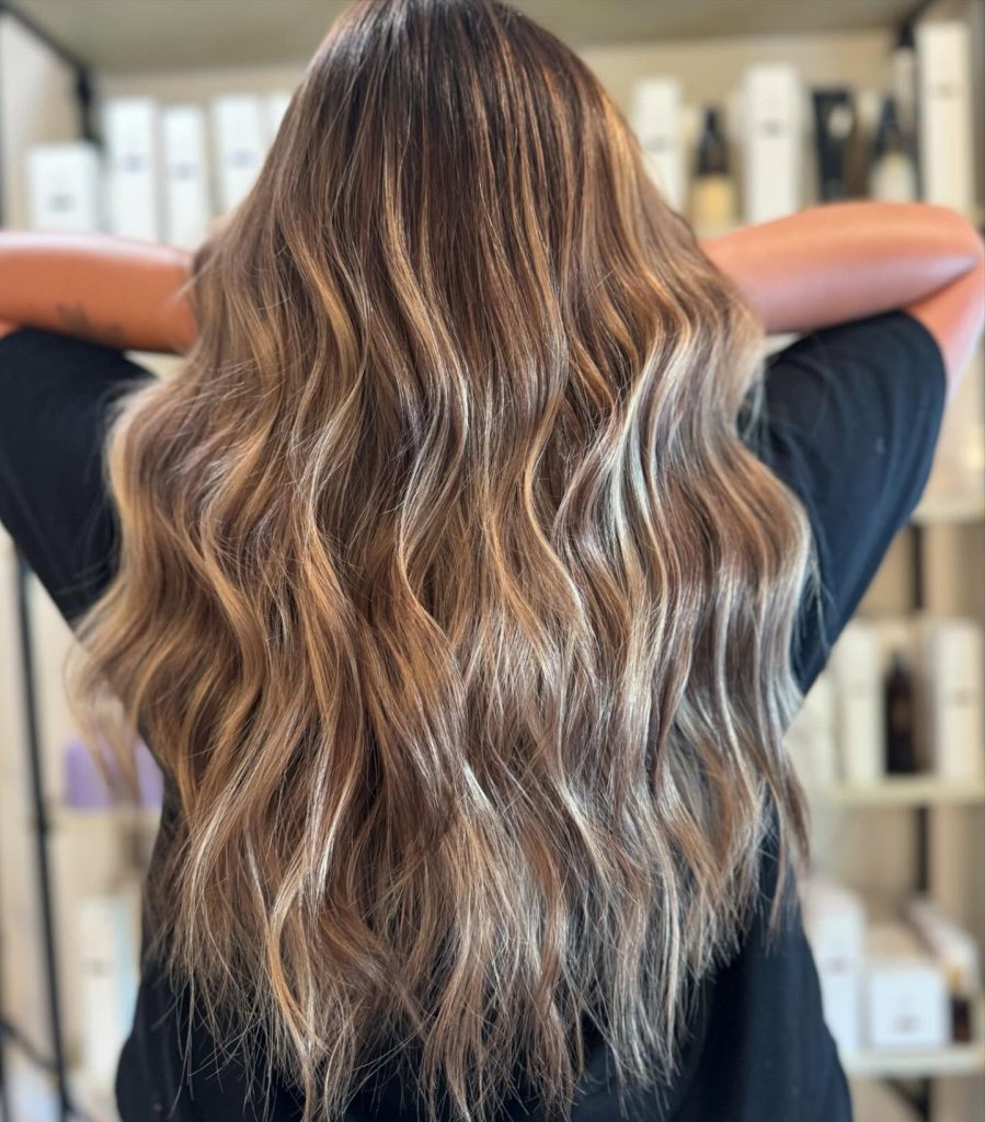 Client receiving expert Bedminster color correction at Beautique Hair Design, where professional colorists specialize in hair color repair and salon color fix.